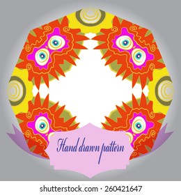 Circular pattern of colored floral motif, label. Hand drawn.
