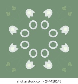 Circular  pattern of colored floral motifs   on a  pale green background. 