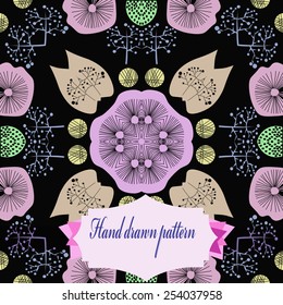 Circular  pattern of colored floral motifs, label   on a black   background.Hand drawn. 