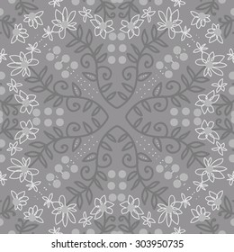 Circular   pattern of floral  motif, branches,  ellipses, flowers, leaves. Hand drawn.