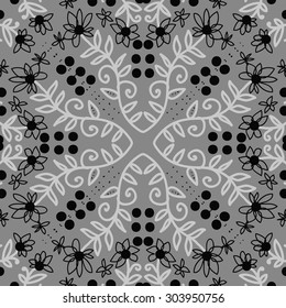 Circular   pattern of floral  motif, branches,  ellipses, flowers, leaves. Hand drawn.