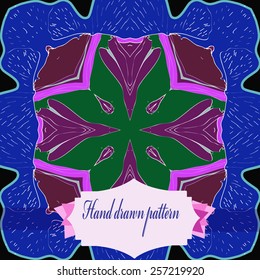 Circular pattern of floral motif, label on a  black  background. Hand drawn.