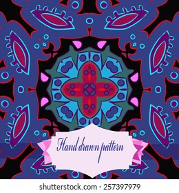 Circular pattern of floral motif, label on a black  background. Hand drawn. 