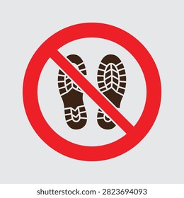 A circular red prohibition sign featuring a pair of black shoe prints, indicating that walking, stepping, or entering is strictly forbidden in this specific area or location.