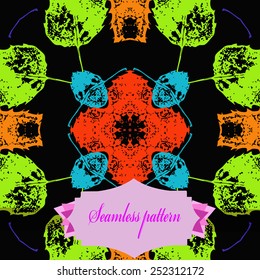 Circular seamless pattern of colored floral motif, autumn leaves, label on a black  background. Hand drawn.