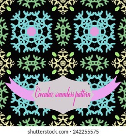 Circular seamless pattern of colored snowflakes, label, text on a  black  background. Hand drawn.