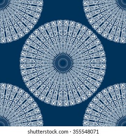 Circular seamless pattern. Ornamental texture. Blue and white graphics, painted by hand. For the design and decoration background, wallpaper, packaging, fabrics, textiles.