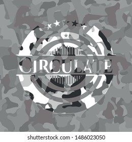 Circulate written on a grey camouflage texture