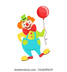 Circus Clown Artist In Classic Outfit With Red Nose And Make Up Holding A Balloon In The Circus Show