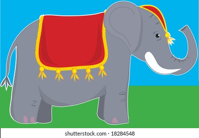 A circus elephant standing still and wearing a fancy blanket and head dress