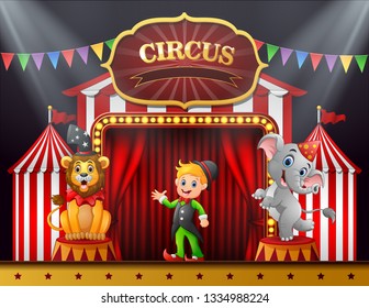 Circus trainer with elephant and lion on the stage