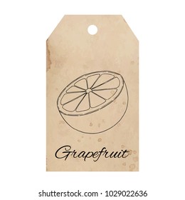 Citrus fruit grapefruit, orange slice on vintage old paper tag background, old aged retro label for special design of packaging, product label, logo, etc. Spilled coffee stain, brown beige color.