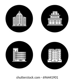 City buildings glyph icons set. Shopping mall, business center, skyscraper, multi-storey building. Vector white silhouettes illustrations in black circles