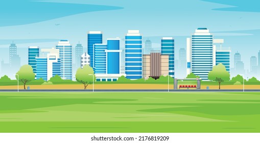 City buildings with green lawns and streets with sky in the background.