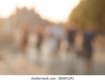 City commuters. High key blurred image of workers going back home after work. Unrecognizable faces, bleached effect.