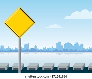 city landscape with blank warning sign