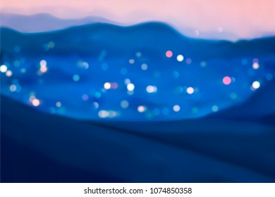City at night with mountain surrounded, blurred lights at night