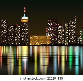 City at night with reflection in water