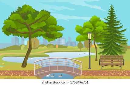 City park with a lawn and trees. Autumn park with plant environmental and lush grass with wooden bench with lake and floating ducks, pedestrian bridge and street lamps against background of buildings