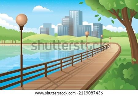 City park with road near the river and city buildings, street lights . Handrail near the river.