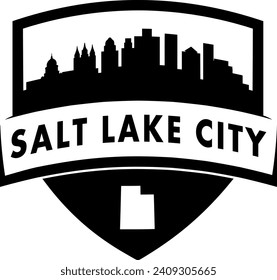 City of Salt Lake City Utah black and white shield style city buildings silhouette shield graphic with knockout white outline of the state border shape under name. Vector eps design. 