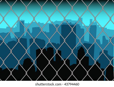City scape skyline behind a metal fence with blue sky