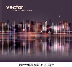 City skyline at night with reflection in water