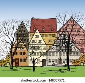 City street with ancient cozy buildings Autumn cityscape. Old european town street houses. Sketch vector illustration.