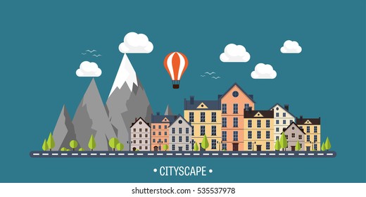 City in summer. Urban landscape with mountains. Town. Mountain peak,snow. House in village. Weather.