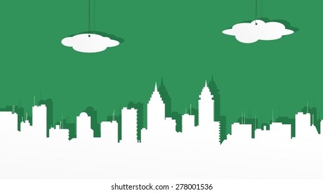 The city from white paper on a green background.