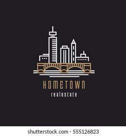 Cityscape real estate logo template with buildings, skyscrapers and bridge in gold and white color combination 