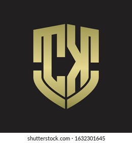 CK Logo monogram with emblem shield shape design isolated gold colors on black background
