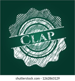 Clap chalkboard emblem on black board