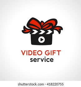 Clapperboard with Bow Suggesting Wrapped Gift Box. Original Unusual Graphic Symbol for Video Gift Service. Vector Illustration.