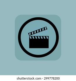 Clapperboard in circle, in square, on pale blue background