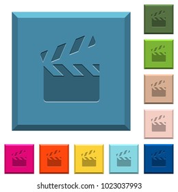 Clapperboard engraved icons on edged square buttons in various trendy colors