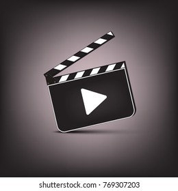 Clapperboard with play symbol on brown background. Vector cinema illustration.