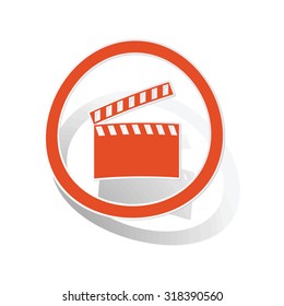 Clapperboard sign sticker, orange circle with image inside, on white background