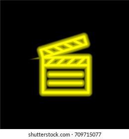 Clapperboard yellow glowing neon ui ux icon. Glowing sign logo vector