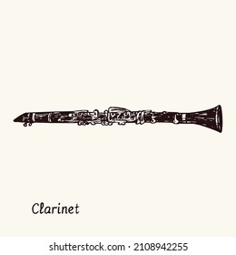 Clarinet. Ink black and white doodle drawing in woodcut style with inscription.