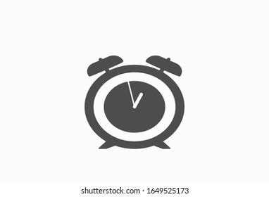 Classic alarm clock over white background