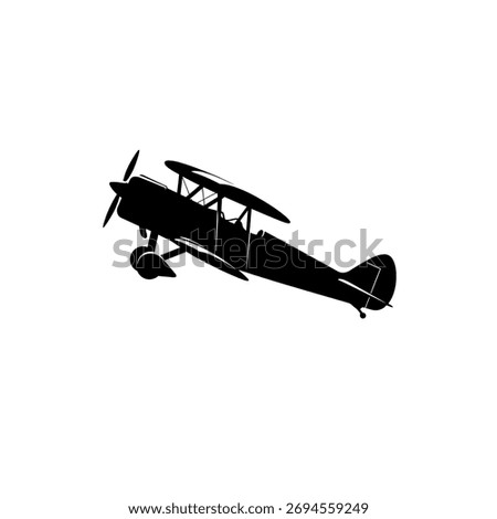 A classic biplane, an old-fashioned aircraft with two main wings, captured in a stark black silhouette against a white background, evoking a sense of nostalgia and aviation history.