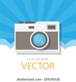 Classic camera flat design with morning sky background.