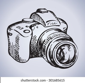 Classic camera isolated on white background. Vector linear freehand ink drawn backdrop sketchy in art scrawl style felt-tip pen on paper. View close-up with space for text