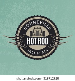 Classic car emblem. Hot rod icon with flame on blue grunge background.