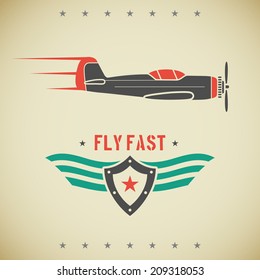 Classic flat looking fast plane and emblem with shield and wings