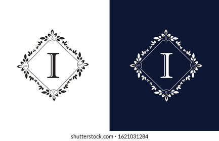 Classic floral monogram on black and white background with letter I. Design for wedding invitations, business sign.
