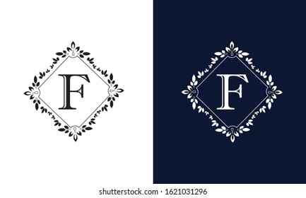 Classic floral monogram on black and white background with letter F. Design for wedding invitations, business sign.
