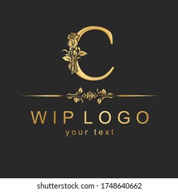 Classic logo with a flower. Gold rose on the capital letter.