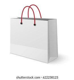 Classic paper shopping bag with red handles made of ropes isolated